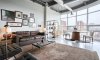 Light floods the living room in this gorgeous apartment.