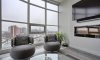 Floor-to-ceiling glass offering panoramic City views.