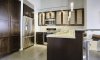 Glass front cabinets and a built-in pantry highlight this upgraded kitchen.