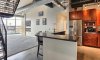 A spacious kitchen opens to expansive living space.