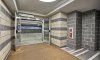 Custom two-tone block in the foyer off of the private garage.